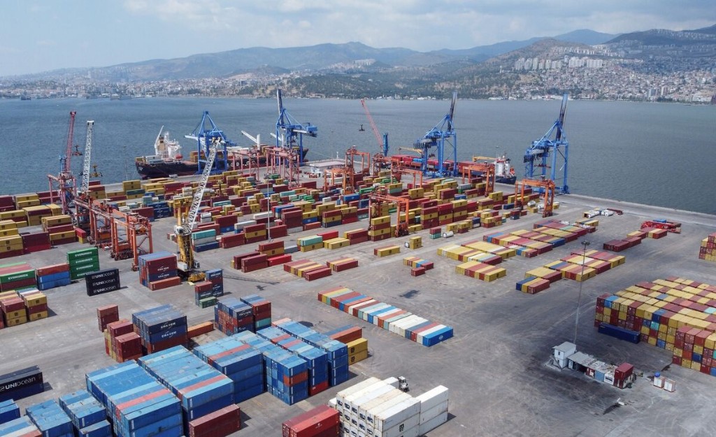 Aerial view of Izmir Alsancak Port container terminal with colorful stacks, cranes, and the city skyline